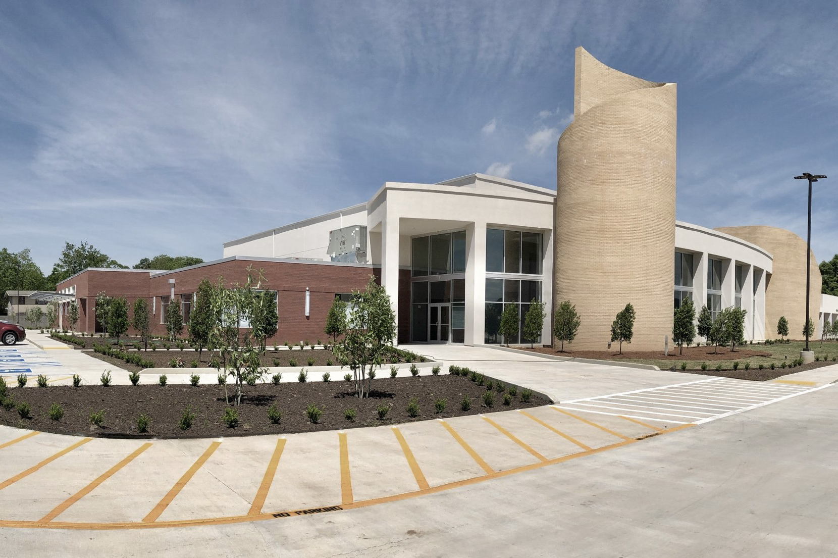 Destiny of Faith Christian Center exterior with stucco brick and tower element designed by A Beazley Architecture